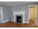Living room featuring a decorative fireplace and hardwood flooring at 802 Lewis St, Gastonia, NC 28054