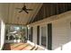 Covered porch featuring a ceiling fan and windows overlooking the surroundings at 802 Lewis St, Gastonia, NC 28054