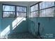 Bright sunroom featuring patterned flooring and multiple windows offering natural light at 802 Lewis St, Gastonia, NC 28054