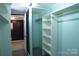 Walk-in closet with organized shelving, providing ample storage in a homey setting at 802 Lewis St, Gastonia, NC 28054