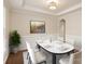 Elegant dining room featuring tray ceilings, wainscoting, and ample seating for entertaining at 83202 Cortland Dr, Lancaster, SC 29720