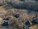 Aerial view of property, nestled among mature trees and landscaping, near a lake community at 8749 Dog Leg Rd # 7, Sherrills Ford, NC 28673