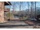 Waterfront backyard featuring a boat on a trailer, a brick exterior, and mature trees offering privacy at 8749 Dog Leg Rd # 7, Sherrills Ford, NC 28673