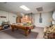 Spacious basement recreational area featuring a pool table, seating, and ample storage space at 8749 Dog Leg Rd # 7, Sherrills Ford, NC 28673