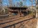 Charming two-story lake house with a spacious porch and natural wood exterior, nestled among mature trees at 8749 Dog Leg Rd # 7, Sherrills Ford, NC 28673