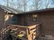 Charming exterior elevation showcasing natural wood and updated deck, and inviting curb appeal at 8749 Dog Leg Rd # 7, Sherrills Ford, NC 28673