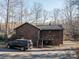 Charming cabin-style home with wood siding, and a truck parked in the driveway at 8749 Dog Leg Rd # 7, Sherrills Ford, NC 28673