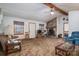 Spacious living room featuring a fireplace, natural light and carpeted floors at 8749 Dog Leg Rd # 7, Sherrills Ford, NC 28673