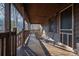 Covered front porch featuring rocking chairs and a natural wood design, offering a relaxing outdoor space at 8749 Dog Leg Rd # 7, Sherrills Ford, NC 28673