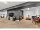 Finished basement area with recreational equipment and a comfortable seating area at 8802 Glenside St, Huntersville, NC 28078