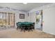 Basement dining area with a round table and chairs, and a sliding glass door at 8802 Glenside St, Huntersville, NC 28078