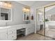 Spacious bathroom with double sinks, a vanity area, large mirror, and a large closet at 8802 Glenside St, Huntersville, NC 28078