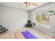Well-lit bedroom features a large window with scenic views and several plants at 8802 Glenside St, Huntersville, NC 28078
