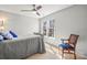 Inviting bedroom featuring a cozy bed, chair, and window for natural lighting at 8802 Glenside St, Huntersville, NC 28078