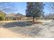 Community clubhouse with a circular driveway and meticulously maintained landscaping at 8802 Glenside St, Huntersville, NC 28078