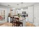Well-equipped kitchen with stainless steel appliances, granite countertops, and a breakfast bar island at 8802 Glenside St, Huntersville, NC 28078