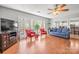 Spacious living room with hardwood floors, comfortable seating, and large windows for natural light at 8802 Glenside St, Huntersville, NC 28078