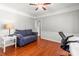 Cozy home office with a comfortable sofa, desk, and chair, perfect for remote work and studying at 8802 Glenside St, Huntersville, NC 28078