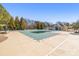 Community pool with a pool cover, a sun deck, and a covered lounge area at 8802 Glenside St, Huntersville, NC 28078