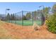 Community tennis court with lighting, surrounded by a chain-link fence at 8802 Glenside St, Huntersville, NC 28078