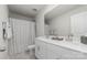Bathroom with double vanity, large mirror, and patterned shower curtain at 920 Clementine Rd, Monroe, NC 28110