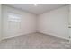 Carpeted bedroom with a window at 920 Clementine Rd, Monroe, NC 28110