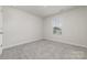 Bright bedroom with neutral carpet, a window, and ample natural light at 920 Clementine Rd, Monroe, NC 28110