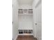Well-organized mudroom with built-in storage, including shelves and hooks for shoes and coats at 920 Clementine Rd, Monroe, NC 28110