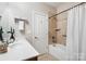 Cozy bathroom featuring a bathtub with shower and tiled walls at 1209 Waypoint Ct, Matthews, NC 28104