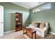 Comfortable bedroom with a sofa, bookshelf, and natural light from a window at 1209 Waypoint Ct, Matthews, NC 28104