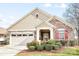 Charming single-Gathering home featuring a stone and siding exterior with a well-manicured front yard at 1209 Waypoint Ct, Matthews, NC 28104