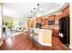 Open floor plan kitchen featuring granite countertops, stainless steel appliances and views into the living area at 1209 Waypoint Ct, Matthews, NC 28104