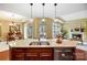 Gourmet kitchen island with granite countertops, stainless steel appliances, and pendant lighting at 1209 Waypoint Ct, Matthews, NC 28104