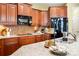 Gourmet kitchen featuring granite countertops, stainless steel appliances, and custom cabinetry, designed for culinary enthusiasts at 1209 Waypoint Ct, Matthews, NC 28104