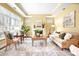 Inviting living room with tray ceilings, fireplace, large windows, and neutral decor, perfect for relaxation at 1209 Waypoint Ct, Matthews, NC 28104