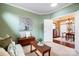 Cozy living room with neutral walls, art, and a view into the dining room at 1209 Waypoint Ct, Matthews, NC 28104