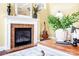 Comfortable living room with a fireplace, guitar, and decorative accents at 1209 Waypoint Ct, Matthews, NC 28104