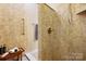 Tiled shower with grab bar, providing a safe and accessible bathing experience at 1209 Waypoint Ct, Matthews, NC 28104