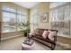 Bright sunroom with large windows offering views of the backyard and surrounding landscape at 1209 Waypoint Ct, Matthews, NC 28104