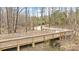 An elevated wooden walking trail surrounded by trees at 1209 Waypoint Ct, Matthews, NC 28104