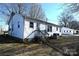 Rear view of the home featuring an elevated wooden deck and white siding at 1433 Buffalo Shoals Rd, Catawba, NC 28609