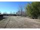 Expansive backyard featuring a chain-link fence, scattered trees, and ample open space at 1433 Buffalo Shoals Rd, Catawba, NC 28609