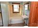 Vintage bathroom with blue tiled walls and a standard tub at 1433 Buffalo Shoals Rd, Catawba, NC 28609