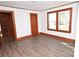Bright bedroom featuring white walls, wood trim, and light vinyl floors with natural light from windows at 1433 Buffalo Shoals Rd, Catawba, NC 28609
