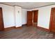 Bright bedroom featuring white walls, wood trim, and light vinyl floors at 1433 Buffalo Shoals Rd, Catawba, NC 28609