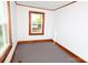 Bedroom with light walls, wood trim, carpet flooring and a window providing ample natural light at 1433 Buffalo Shoals Rd, Catawba, NC 28609