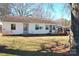 Quaint home featuring white siding, a convenient ramp, and mature trees, creating an inviting space at 1433 Buffalo Shoals Rd, Catawba, NC 28609