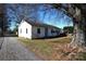 Charming one-story home with a large tree in the front yard and a gravel driveway at 1433 Buffalo Shoals Rd, Catawba, NC 28609