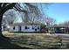 Charming single-story home with a white exterior, complemented by a spacious yard and an open carport at 1433 Buffalo Shoals Rd, Catawba, NC 28609