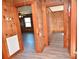 Wood paneled hallway featuring views into other rooms and a fire extinguisher at 1433 Buffalo Shoals Rd, Catawba, NC 28609